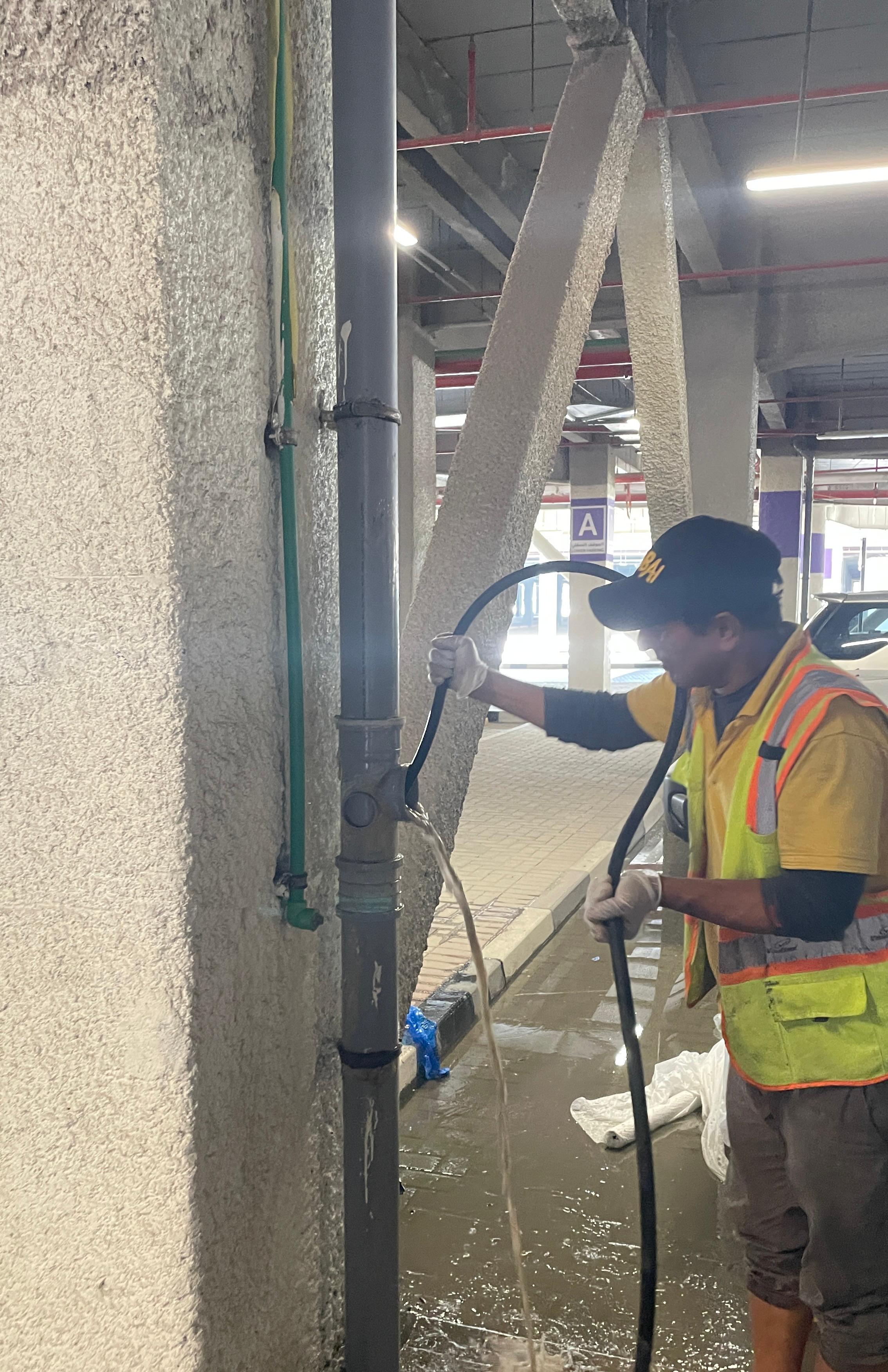 Hydrojetting professional performing high-pressure pipe cleaning